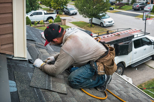 Professional Roofing technician working in Morley, IA